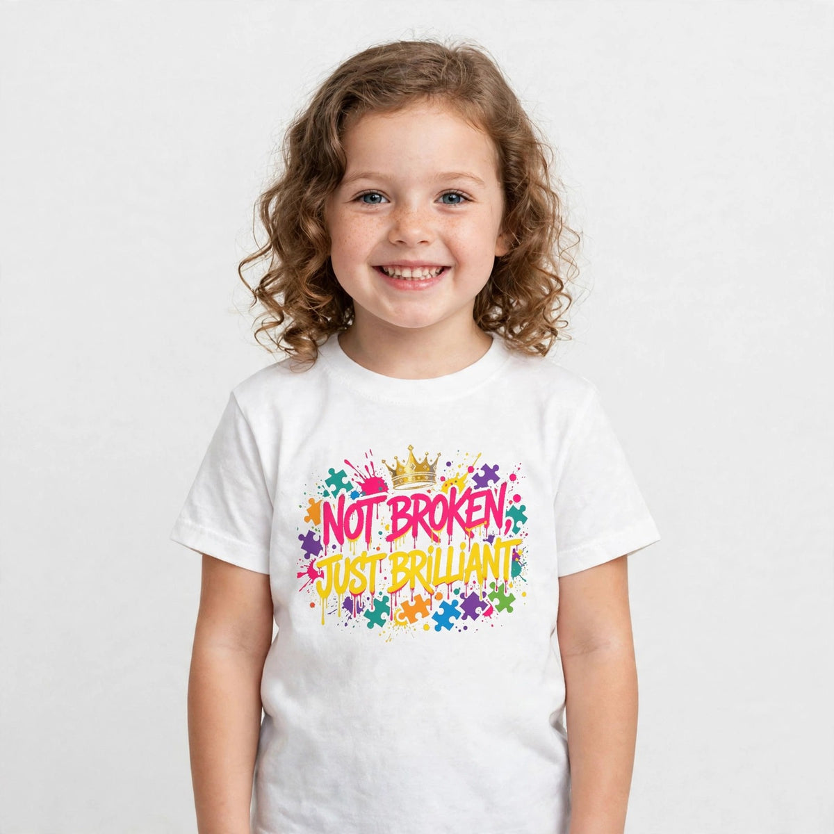 Child wearing the Not Broken Just Brilliant kids t-shirt